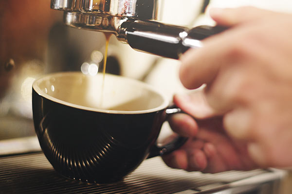 a photo of a fresh cup of coffee being prepared
